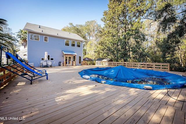 view of pool featuring a wooden deck