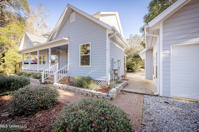 exterior space featuring ceiling fan, a porch, and a garage