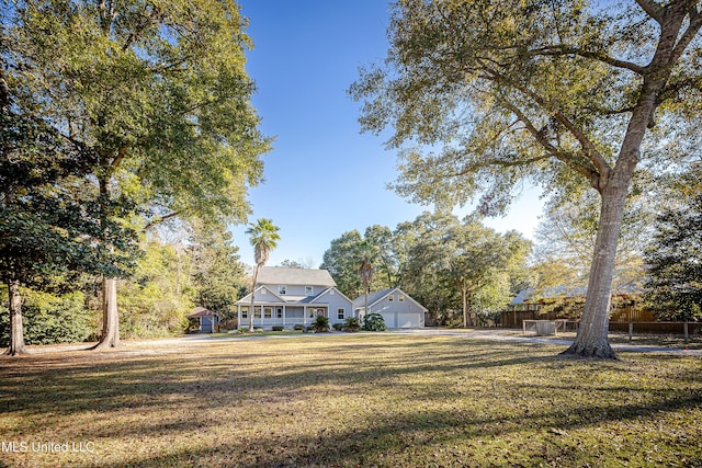 view of front of house with a front lawn and a garage