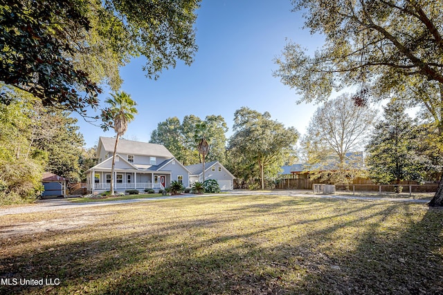 view of yard featuring covered porch