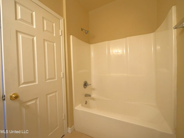 bathroom featuring tile patterned floors and bathtub / shower combination