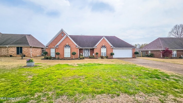 ranch-style house featuring a front yard and a garage