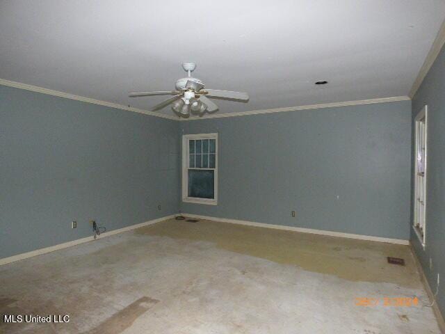 carpeted spare room featuring ceiling fan and crown molding