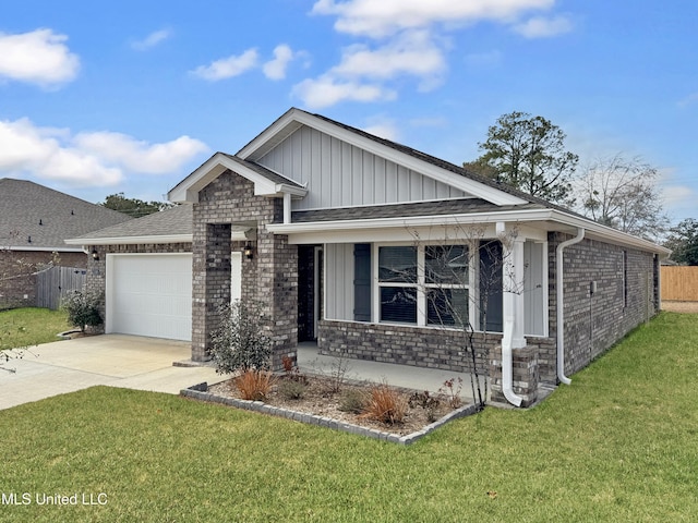 view of front of home featuring a garage and a front yard