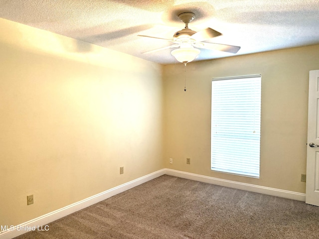 1606 Woodhaven St, Pascagoula, MS 39581 - carpeted empty room with ceiling fan, a textured ceiling, and baseboards