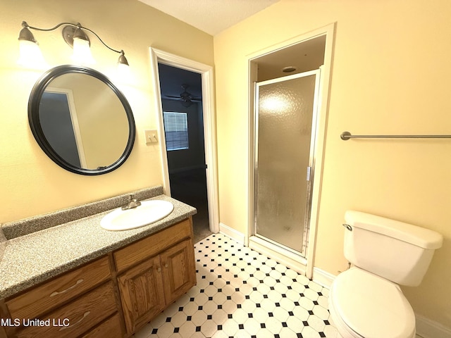 1606 Woodhaven St, Pascagoula, MS 39581 - full bathroom with a stall shower, vanity, toilet, baseboards, and tile patterned floors
