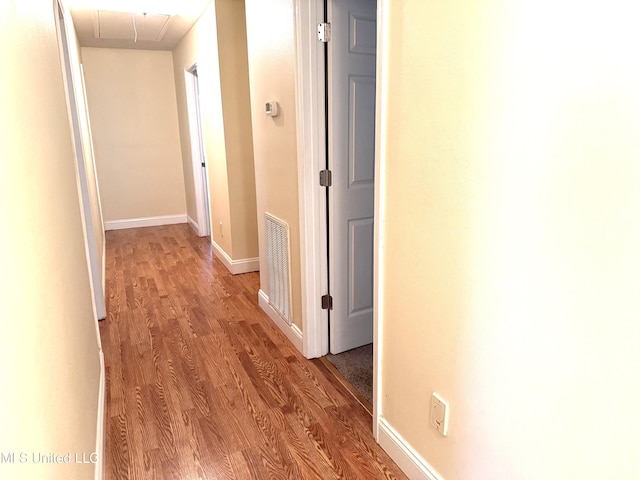 1606 Woodhaven St, Pascagoula, MS 39581 - corridor featuring attic access, light wood-style floors, and baseboards