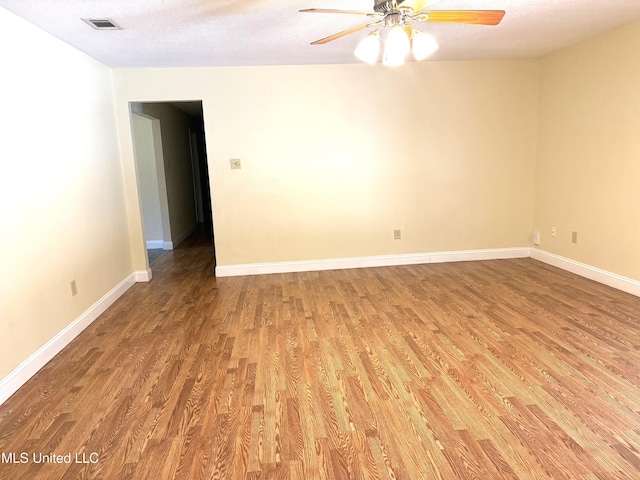 1606 Woodhaven St, Pascagoula, MS 39581 - unfurnished room with light wood finished floors, ceiling fan, and baseboards