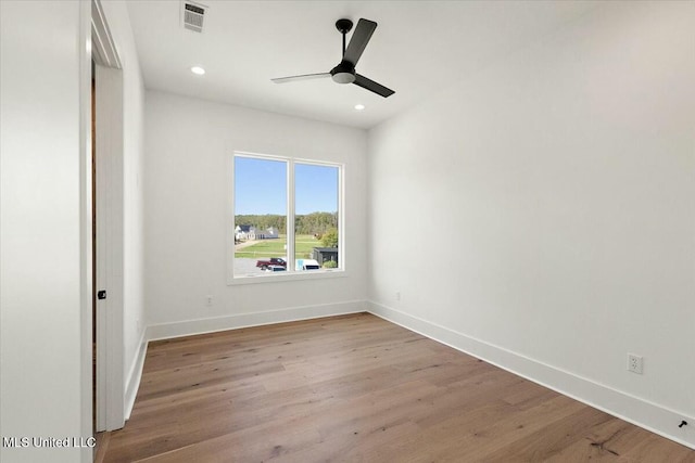 unfurnished room with ceiling fan and light wood-type flooring