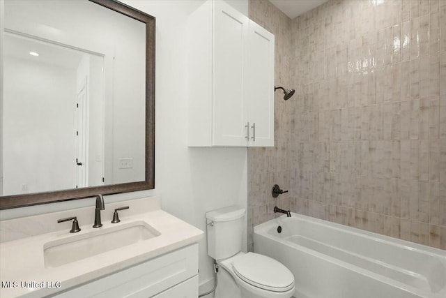 full bathroom featuring vanity, toilet, and tiled shower / bath