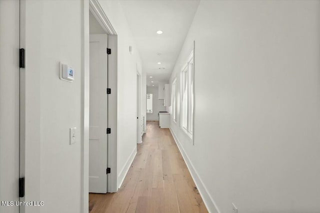 hall with light hardwood / wood-style floors