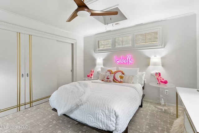 bedroom with a closet, crown molding, and ceiling fan