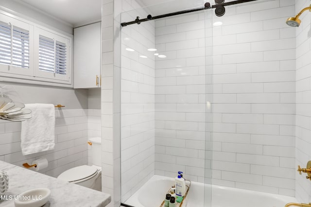 full bathroom with vanity, toilet, and tiled shower / bath