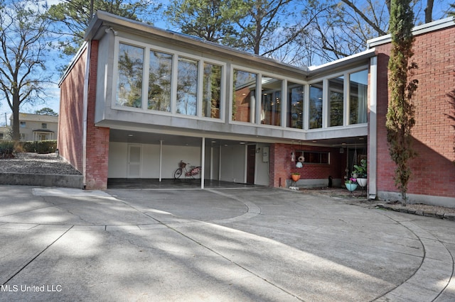 rear view of property featuring a carport