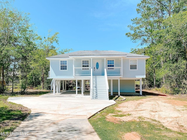 view of front of home with a carport and covered porch