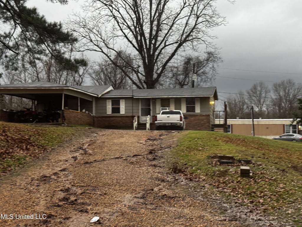 178 Bobo Rd, Lorman, MS 39096 - view of front of home featuring a carport and brick siding