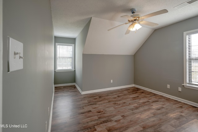 bonus room featuring hardwood / wood-style flooring, plenty of natural light, and vaulted ceiling