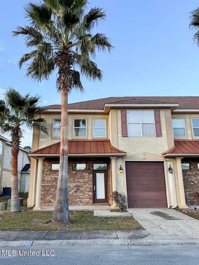 view of front of property with a garage