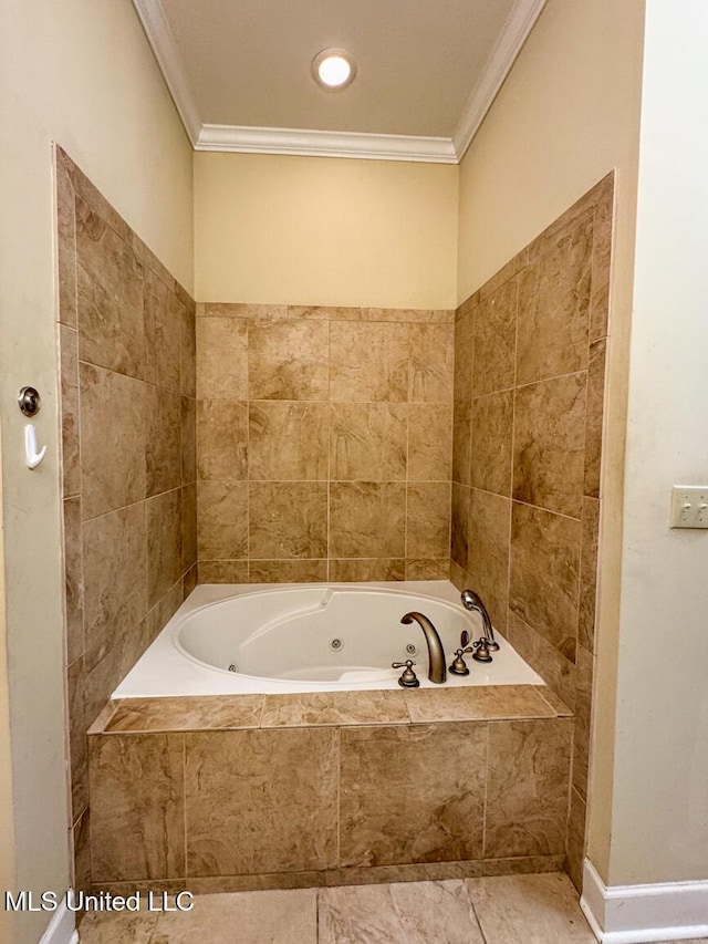 bathroom with tiled tub and ornamental molding