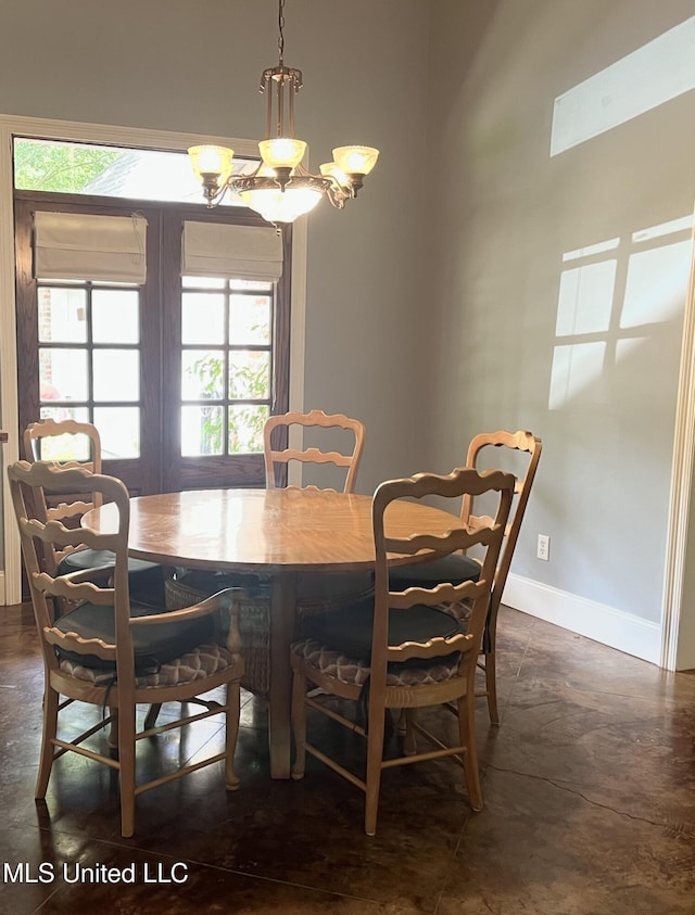 140 Whisper Lake Blvd, Madison, MS 39110 - dining area with baseboards, a chandelier, and concrete floors