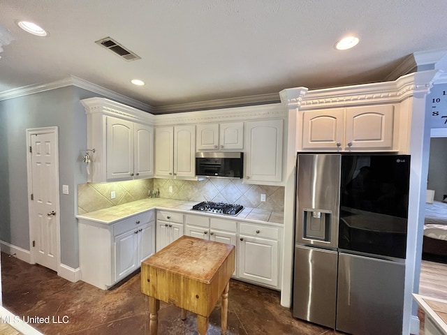 140 Whisper Lake Blvd, Madison, MS 39110 - kitchen featuring appliances with stainless steel finishes, tile countertops, ornamental molding, backsplash, and baseboards