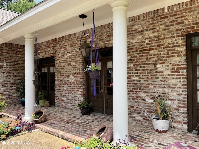 140 Whisper Lake Blvd, Madison, MS 39110 - entrance to property featuring french doors, a porch, and brick siding