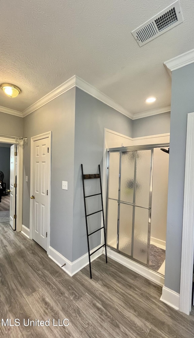 140 Whisper Lake Blvd, Madison, MS 39110 - interior space featuring wood finished floors, a textured ceiling, baseboards, and ornamental molding