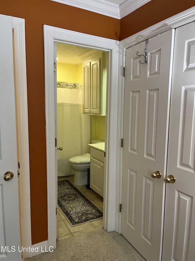 140 Whisper Lake Blvd, Madison, MS 39110 - bathroom with crown molding, vanity, toilet, and tile patterned floors