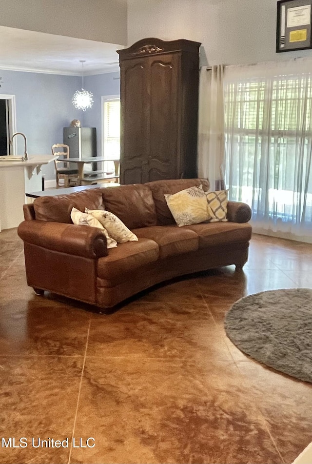 140 Whisper Lake Blvd, Madison, MS 39110 - living room with healthy amount of natural light, crown molding, and tile patterned floors