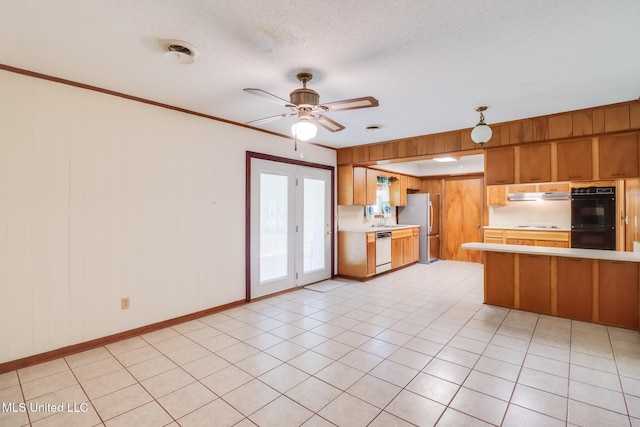 820 Lackland Dr, Biloxi, MS 39532 - kitchen featuring dishwasher, freestanding refrigerator, light countertops, a peninsula, and brown cabinets