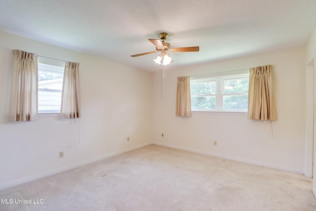 820 Lackland Dr, Biloxi, MS 39532 - empty room featuring light colored carpet, a ceiling fan, and baseboards