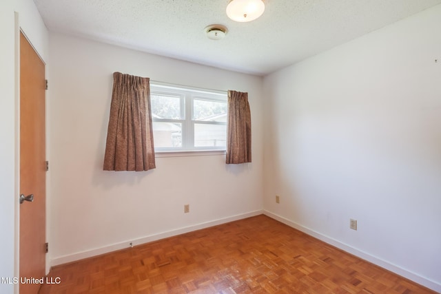 820 Lackland Dr, Biloxi, MS 39532 - empty room featuring baseboards, a smoke detector, and a textured ceiling