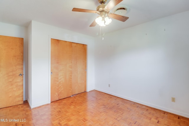 820 Lackland Dr, Biloxi, MS 39532 - unfurnished bedroom featuring baseboards, a closet, and a ceiling fan