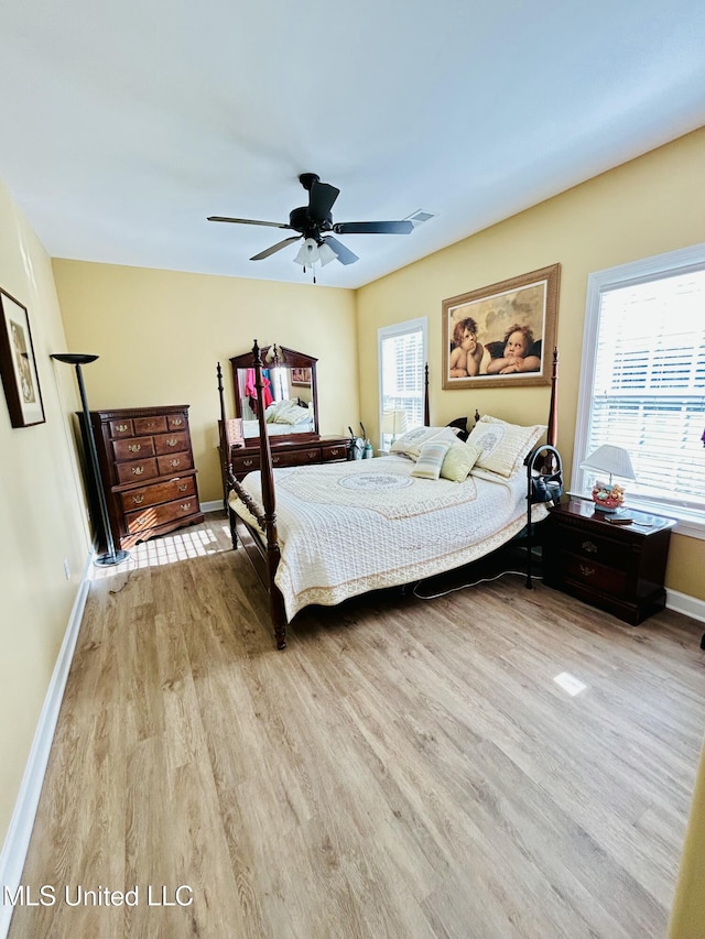 bedroom featuring light hardwood / wood-style flooring and ceiling fan