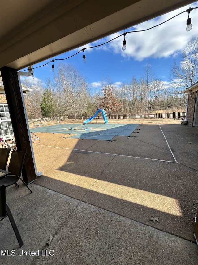 view of patio with a covered pool