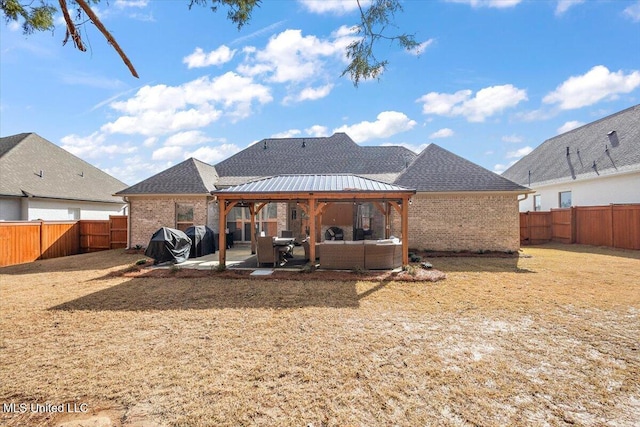 back of house featuring a gazebo, an outdoor hangout area, and a patio area