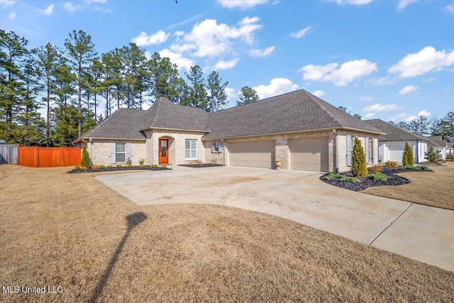 french provincial home with a garage