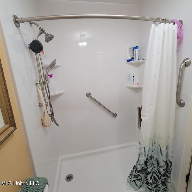 bathroom with a shower with curtain