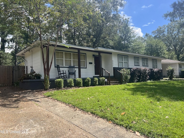 ranch-style home with a front lawn