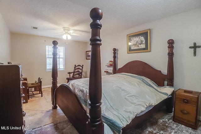 bedroom featuring a textured ceiling, concrete floors, and ceiling fan