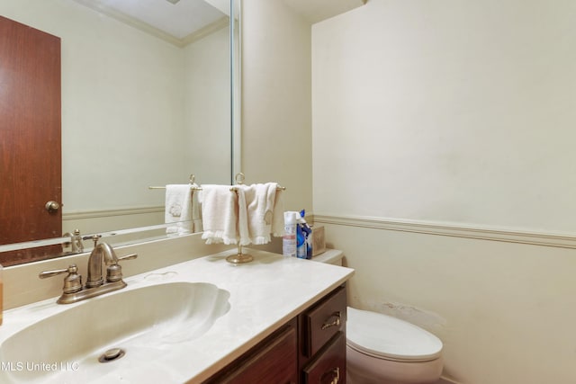 524 Champlin St, Gulfport, MS 39507 - bathroom featuring toilet, vanity, and ornamental molding