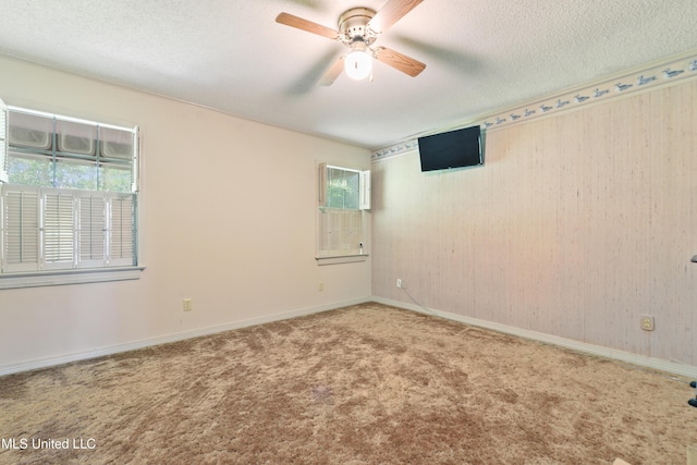 524 Champlin St, Gulfport, MS 39507 - carpeted empty room with ceiling fan, a textured ceiling, and baseboards