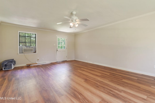 524 Champlin St, Gulfport, MS 39507 - empty room featuring ceiling fan, wood finished floors, baseboards, crown molding, and a baseboard heating unit