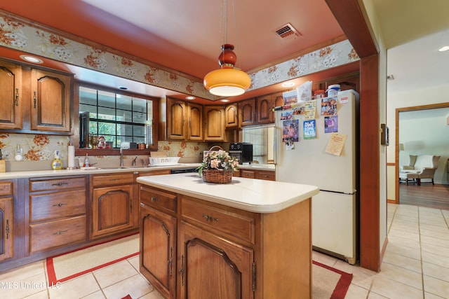 524 Champlin St, Gulfport, MS 39507 - kitchen with freestanding refrigerator, light tile patterned floors, and light countertops