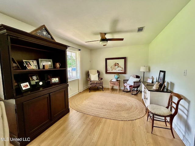 308 College St, Carthage, MS 39051 - living area featuring visible vents, light wood-style floors, ceiling fan, and baseboards