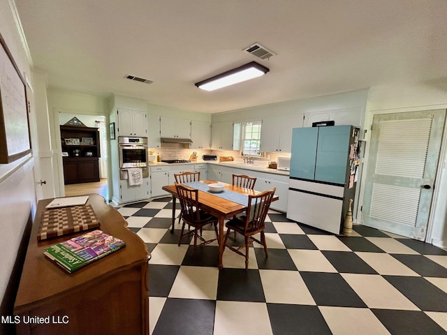 308 College St, Carthage, MS 39051 - dining room with tile patterned floors and visible vents
