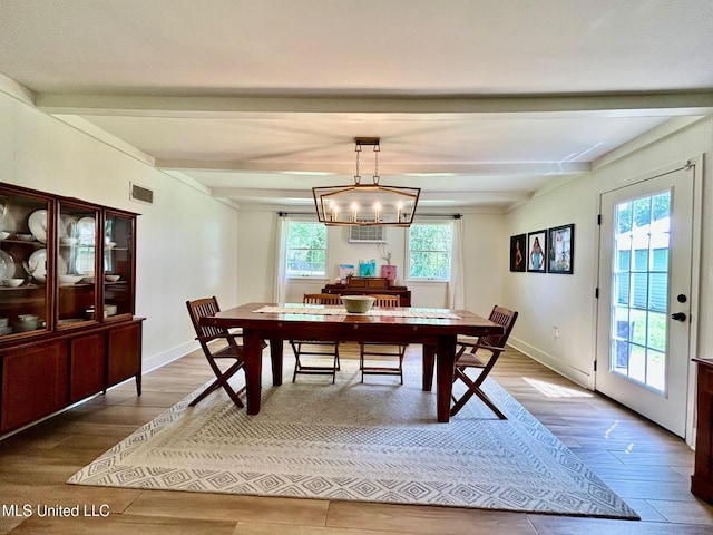 308 College St, Carthage, MS 39051 - dining space with a wealth of natural light, beamed ceiling, and visible vents