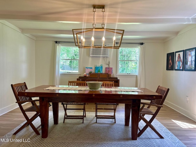 308 College St, Carthage, MS 39051 - dining room featuring beam ceiling, a chandelier, plenty of natural light, and wood finished floors