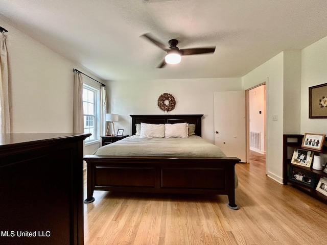 308 College St, Carthage, MS 39051 - bedroom featuring light wood-type flooring, ceiling fan, and visible vents