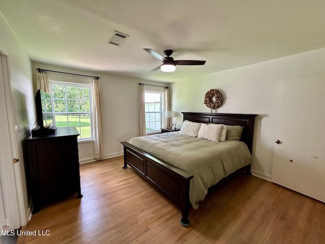 308 College St, Carthage, MS 39051 - bedroom featuring a ceiling fan, baseboards, visible vents, and light wood-type flooring